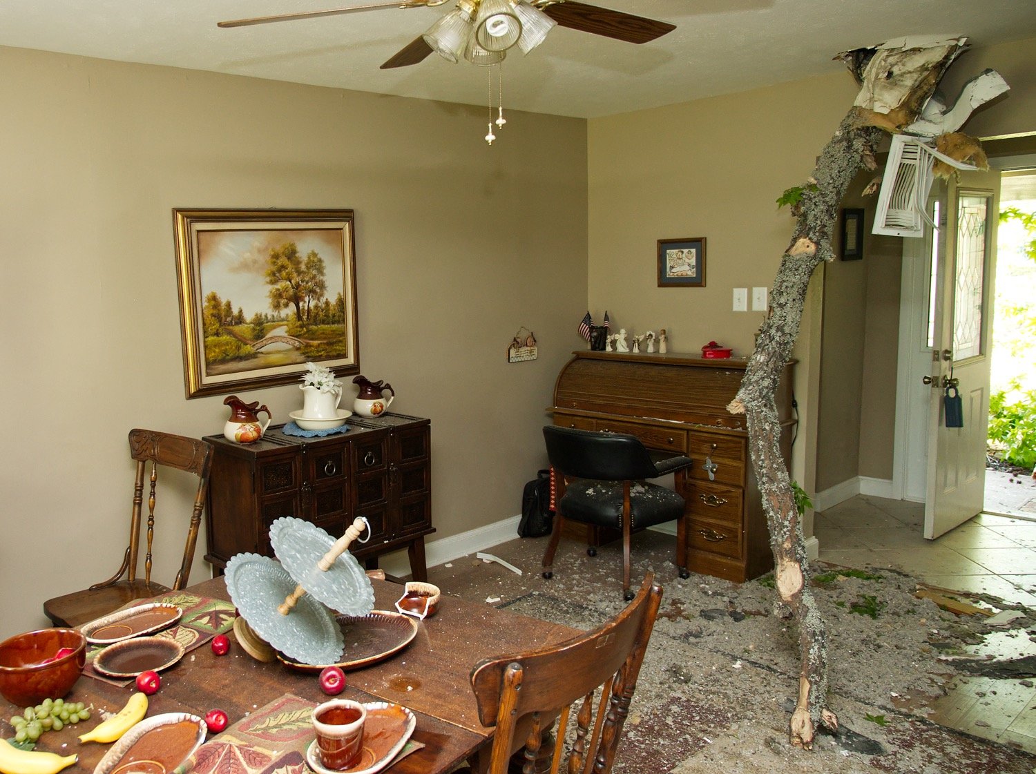 A tree limb displaced the dining room of this home on McDonald Street, moving a large table and chairs several feet, into the opposite wall.